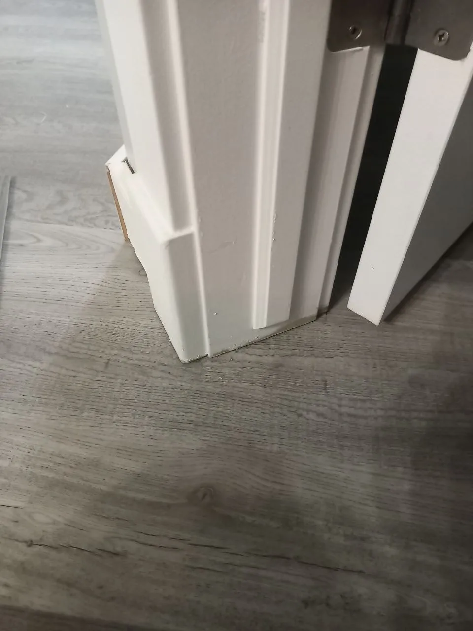 Lvp Baseboard Door Casing Closeup — Stampede Flooring Calgary