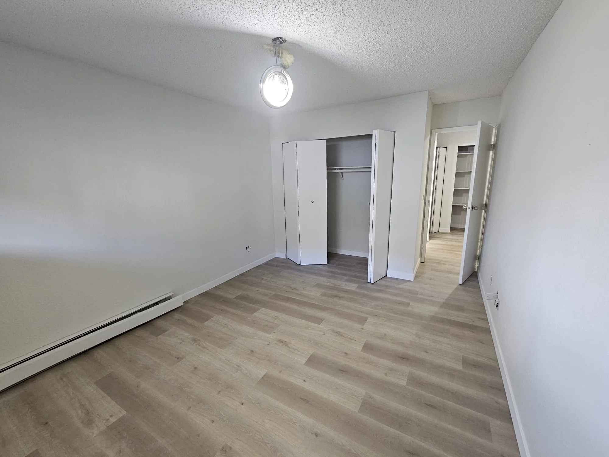 Lvp Bedroom Light Closet Finished — Stampede Flooring Calgary