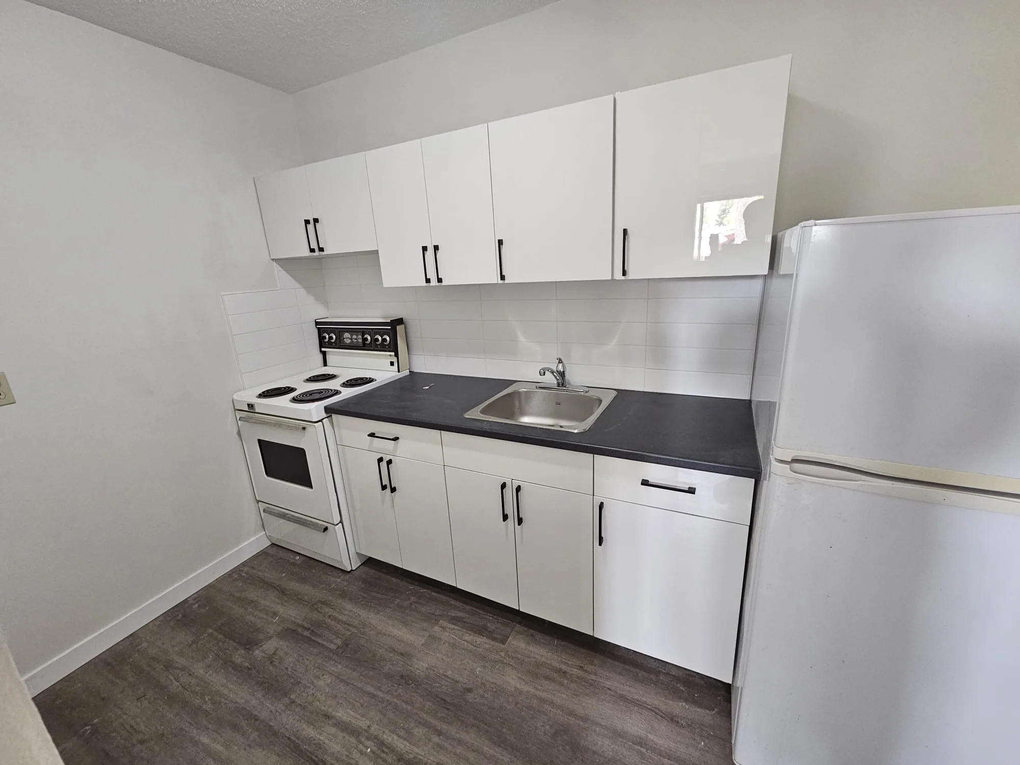 Lvp Kitchen White Cabinets 2 — Stampede Flooring Calgary