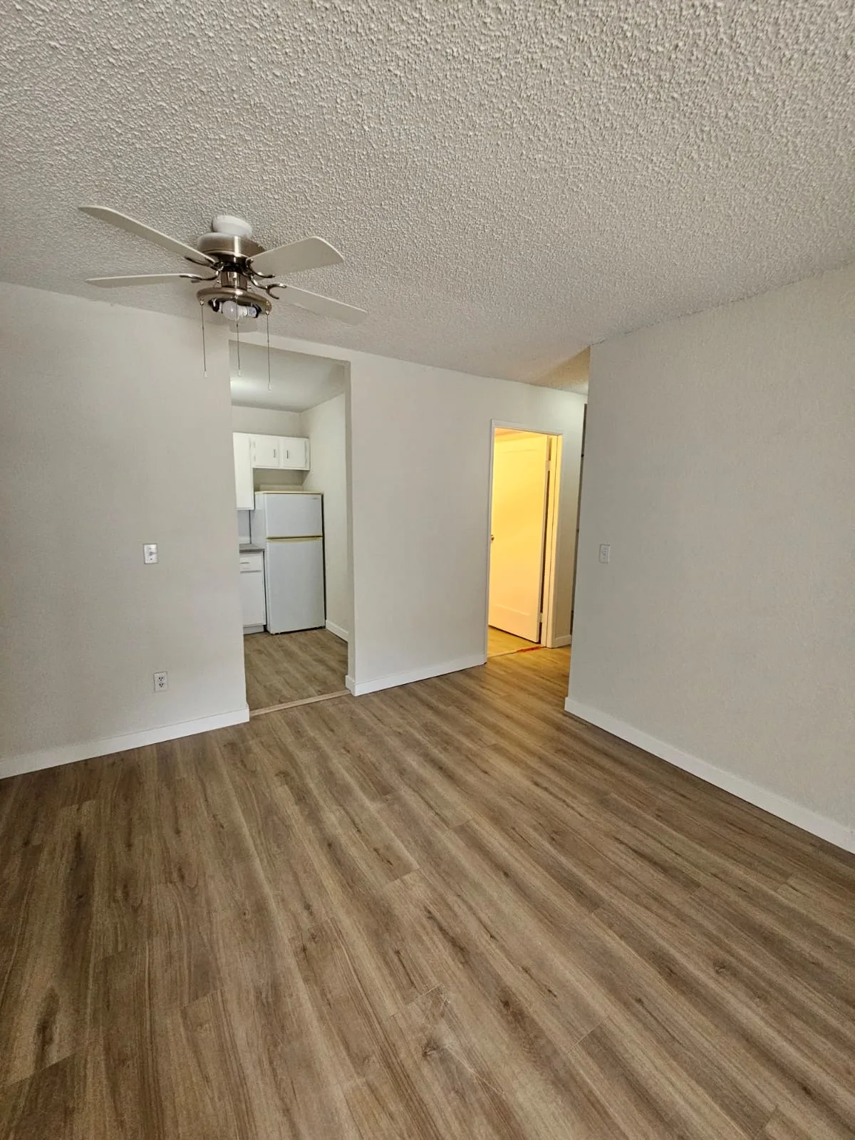 Lvp Living Room Apartment Ceiling Fan — Stampede Flooring Calgary