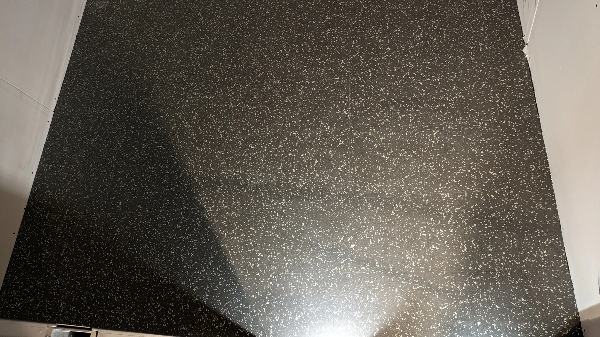 Lvt Black Granite Look Tile — Stampede Flooring Calgary