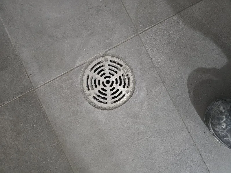 Tile Grey Floor Drain — Stampede Flooring Calgary