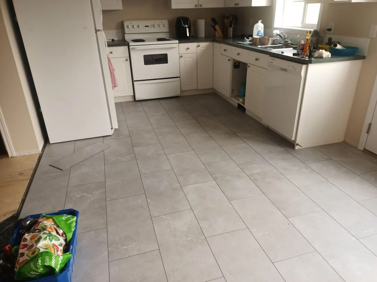 Tile Kitchen Grey Install — Stampede Flooring Calgary