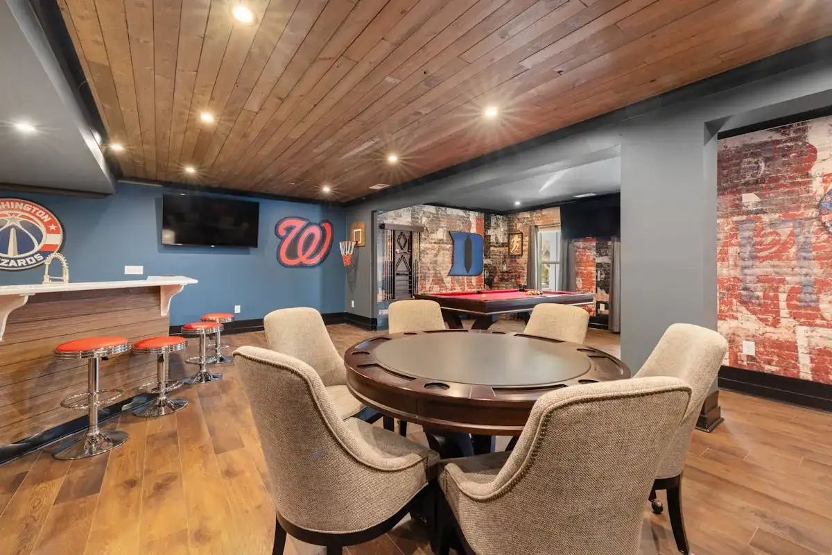 Finished basement flooring in SW Calgary — LVP over concrete with baseboards