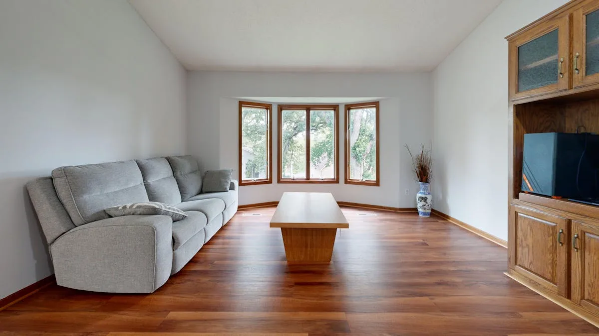 Full home luxury vinyl plank installation in Cochrane Alberta — consistent warm wood tone throughout