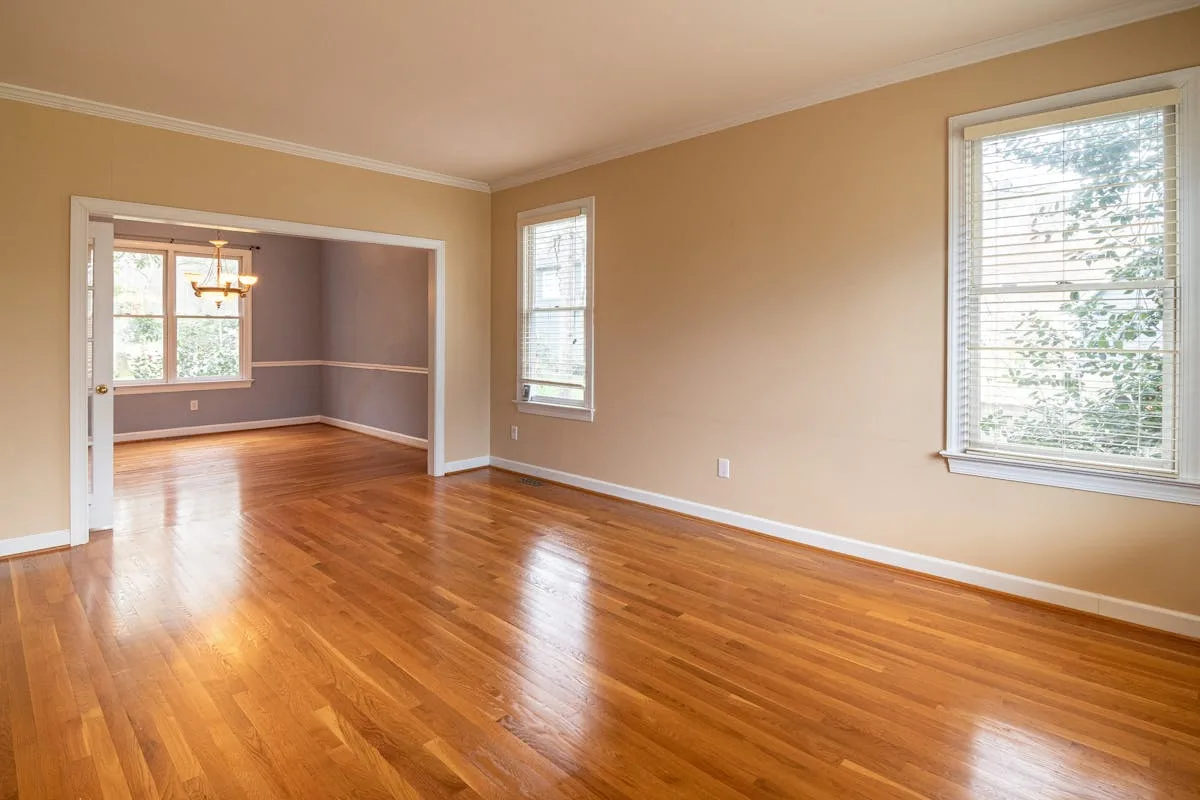 Engineered hardwood main floor installation in Airdrie — wide plank light oak finish
