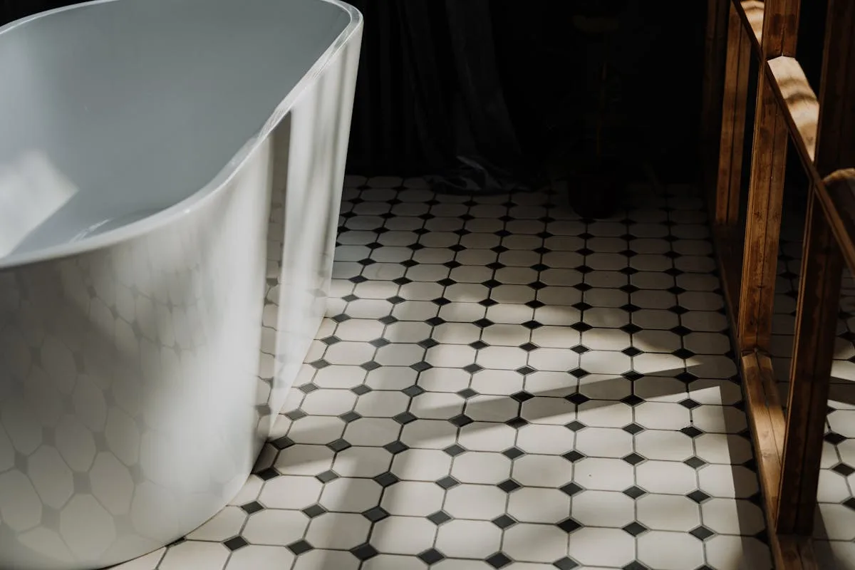 Bathroom tile installation in a Calgary home — porcelain floor tile and shower tile with heated floor system