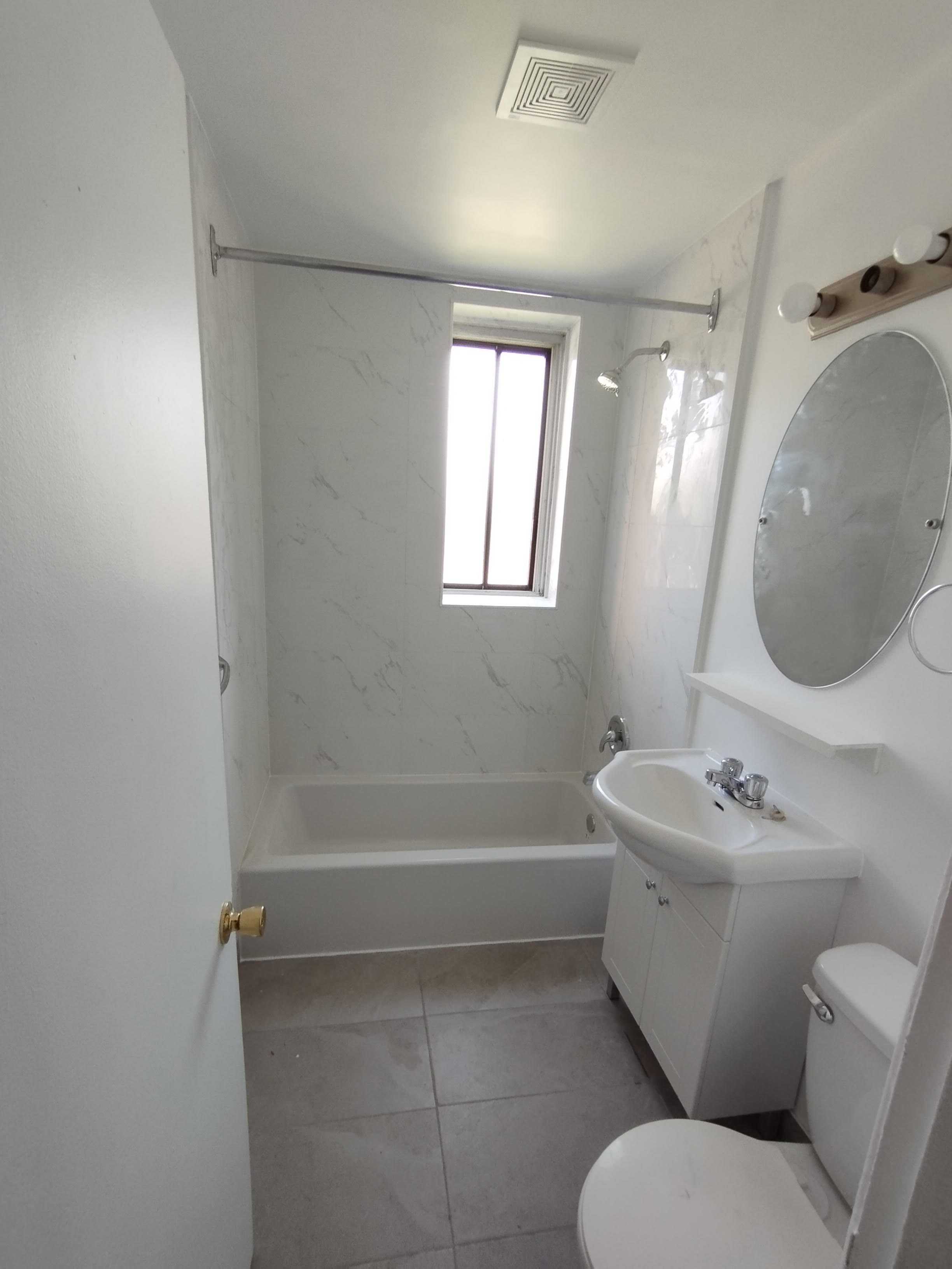 Full bathroom tile renovation in NW Calgary — new floor and shower tile