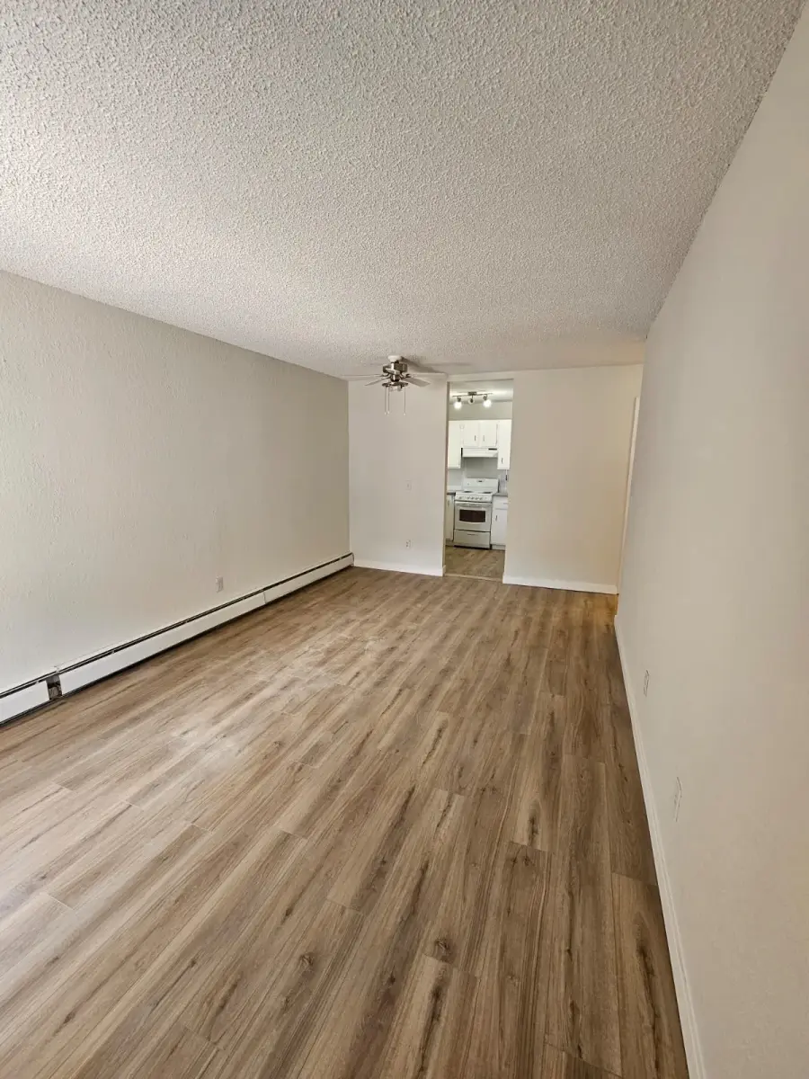 Full basement finish in Cochrane — LVP over concrete with proper subfloor preparation