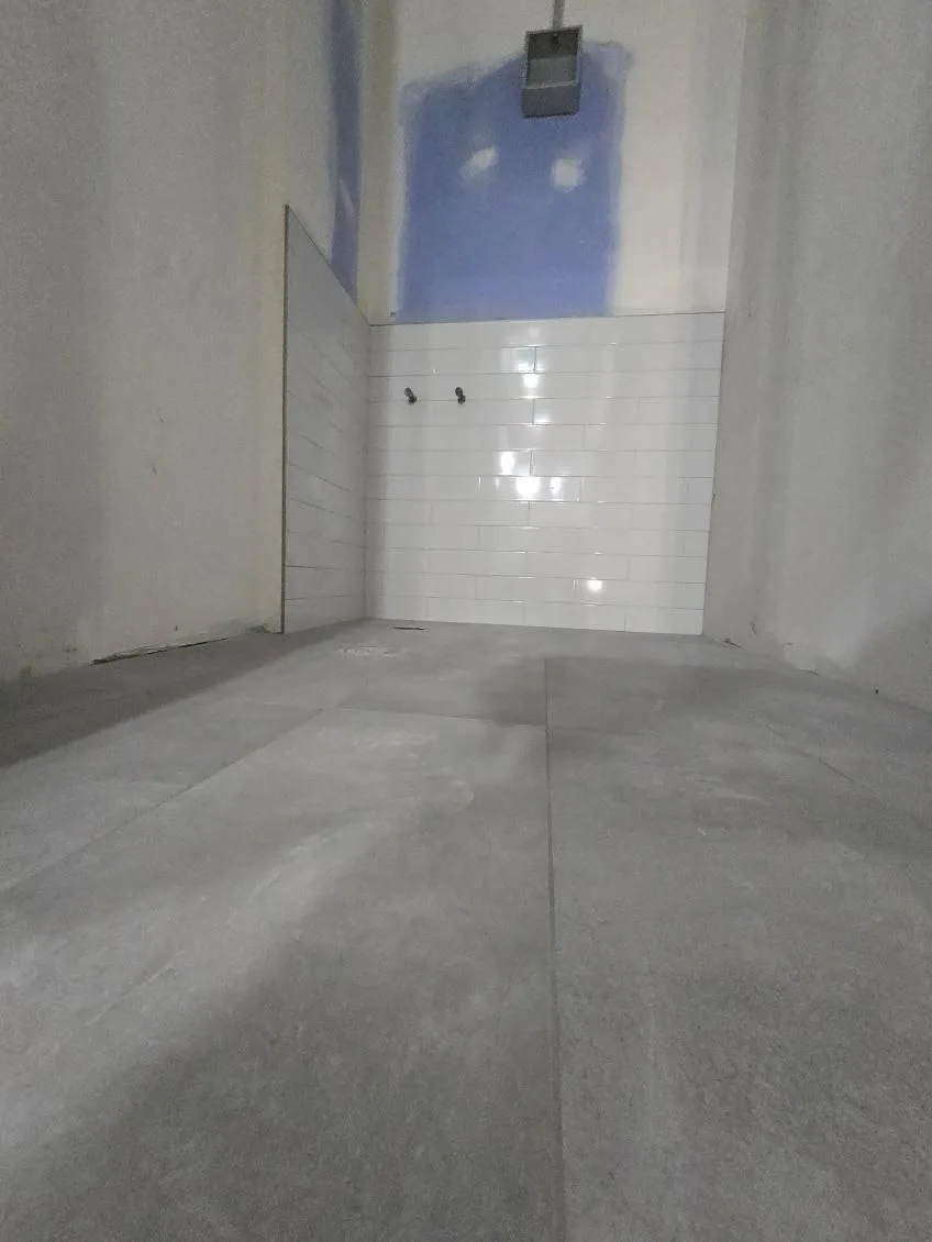 Full bathroom tile renovation in Okotoks — modern porcelain with heated floor